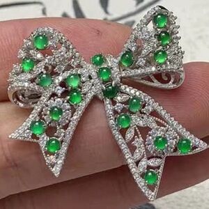 Elegant Silver and Green Bow Brooch